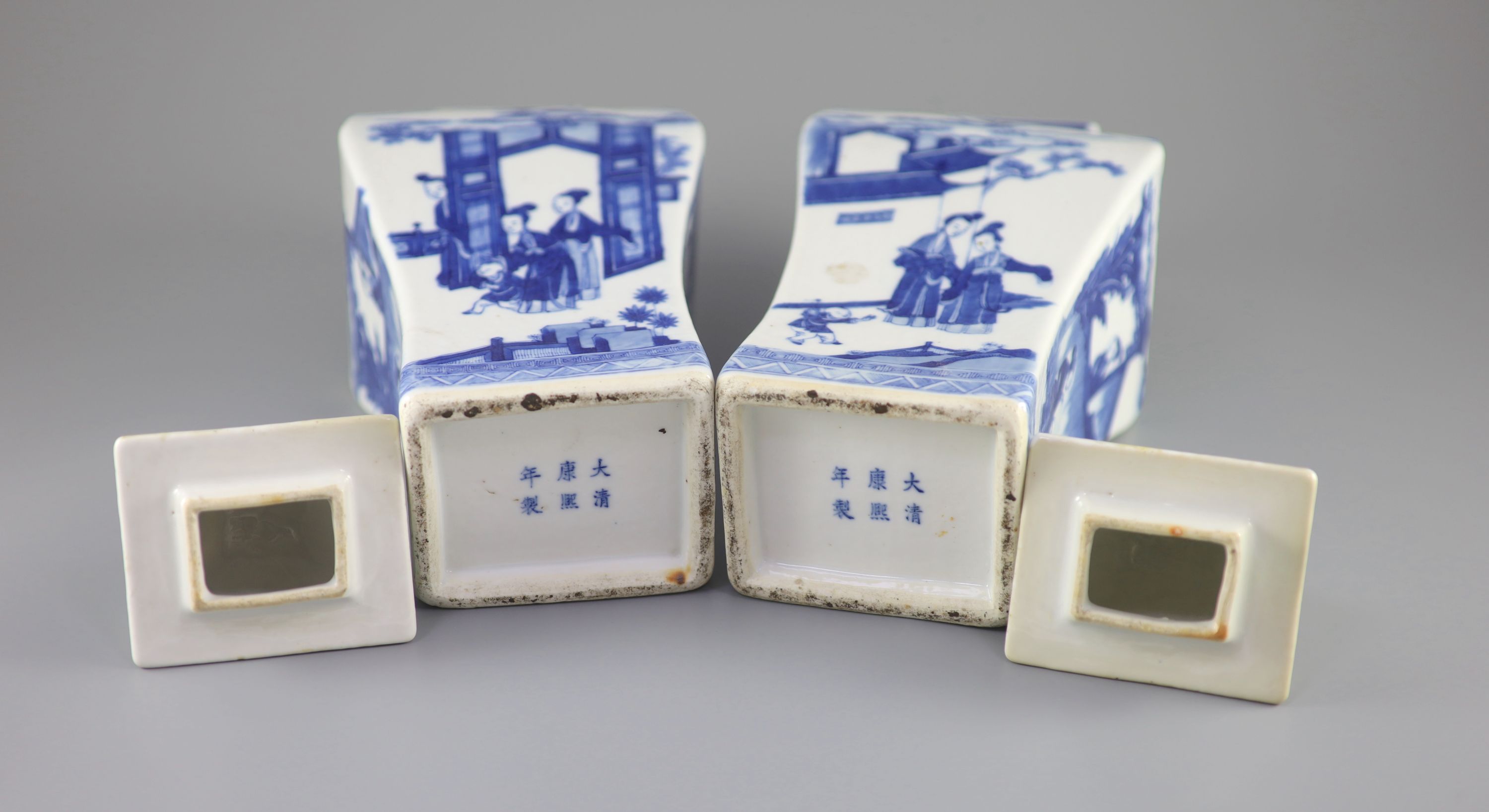 A pair of Chinese blue and white rectangular baluster vases and covers, Kangxi marks but 19th century, 36.5 cm